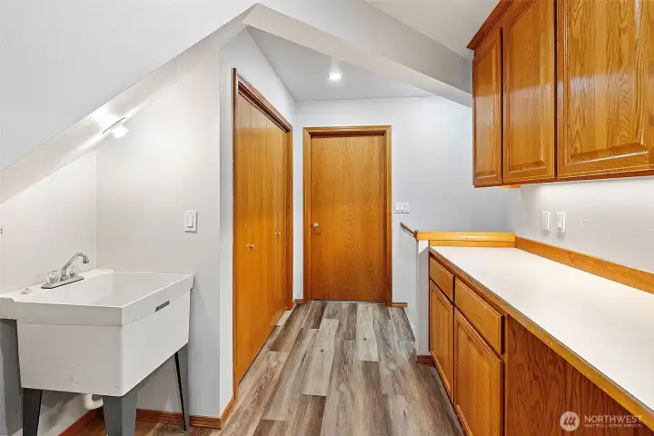 2nd floor utility room with sink and high end appliances