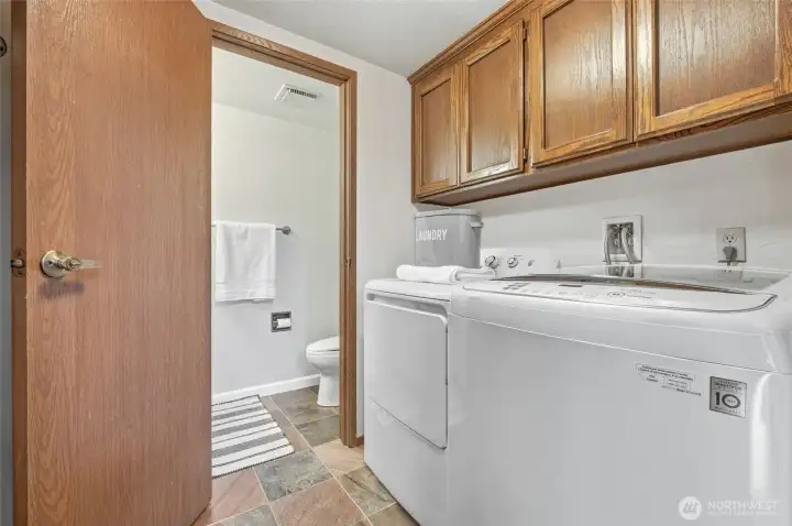 The lower-level laundry area and 1/2 bathroom.