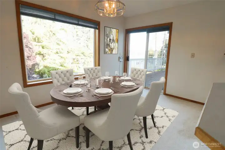 The dining area, virtually staged, with views of Puget Sound and the mountain.