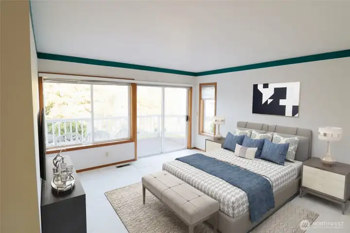The primary suite, shown here virtually staged, with a slider to the front deck, a view of the Sound and Mt. Rainier, and an ensuite bath just steps away.