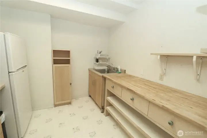 A kitchenette in the daylight basement, part of what makes this lower level feel like a home within a home, ideal for multigenerational living, an ADU, or a rental setup.