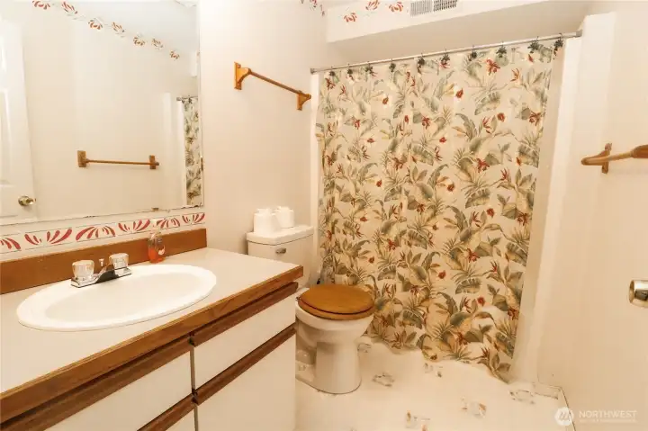 The downstairs bathroom, complete with a tub shower, just steps from the lower level bedrooms.