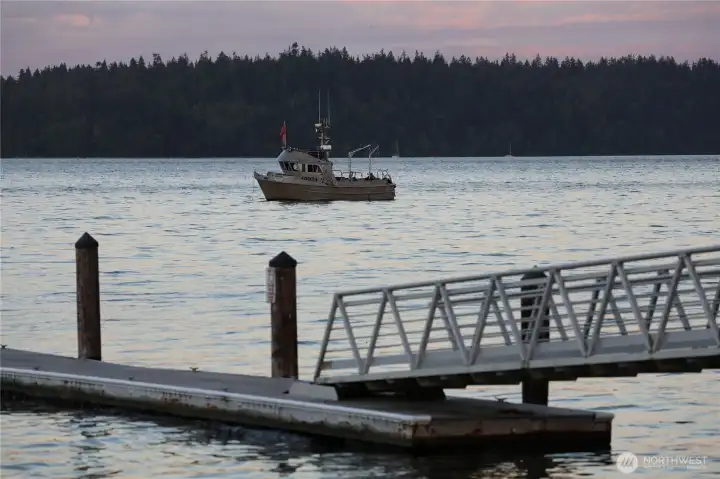 The Manchester pier at dusk, with a fishing boat just offshore. This is the view, and the lifestyle, three minutes from home.