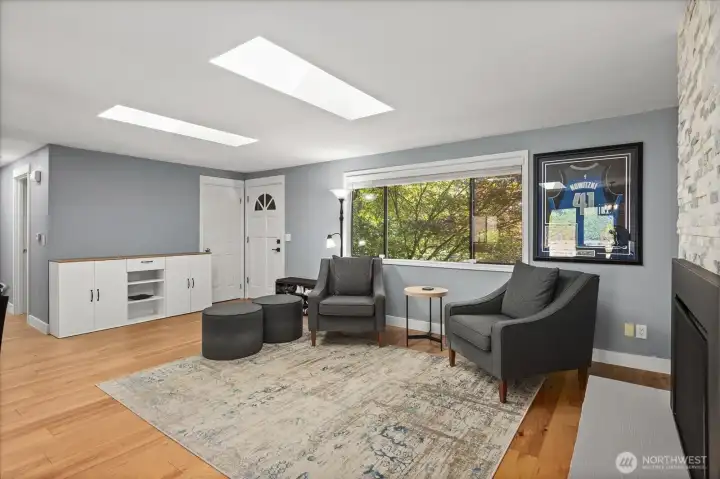 Step inside to this light and bright home with newer skylights, engineered hardwood flooring, new fireplaces, newer roof and more.