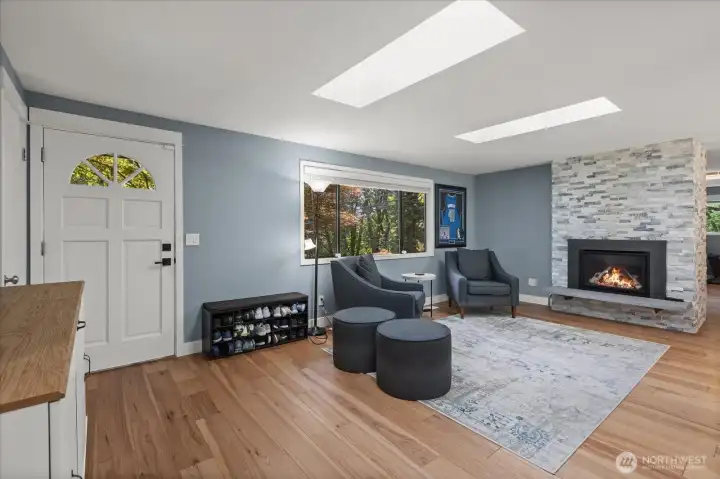 The double sided gas fireplace features two new custom natural gas inserts and stone surround.