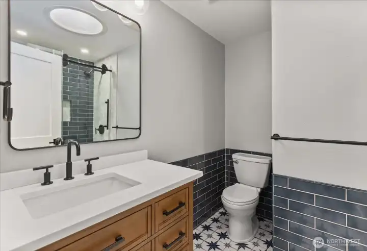 Guest Bathroom - Fully remodeled bathroom with custom tile on floor, walls and shower plus new vanity and soaking tub