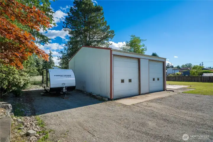 30X36 Detached Shop with two 12 FT. Garage Doors and adjacent RV Parking w/ 30 amp hookup.