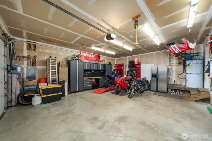 534 SF 2-car garage has tons of workspace, storage, and upgraded insulated garage doors.