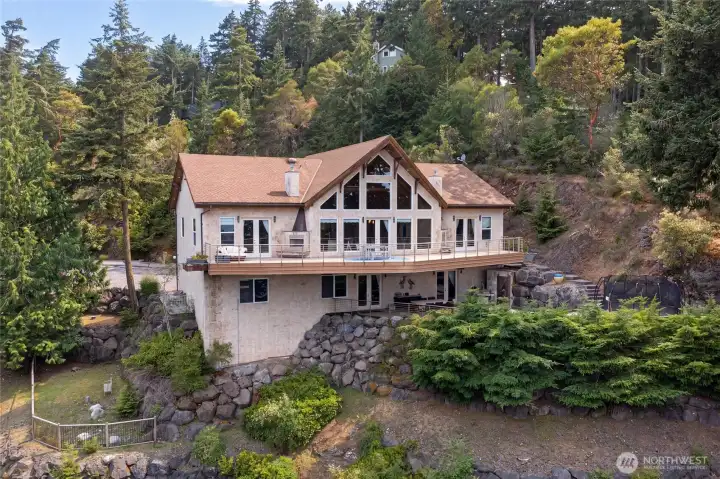 Distinctive prow-front architecture, broad walls of glass, and an expansive upper deck define this custom San Juan Island residence.