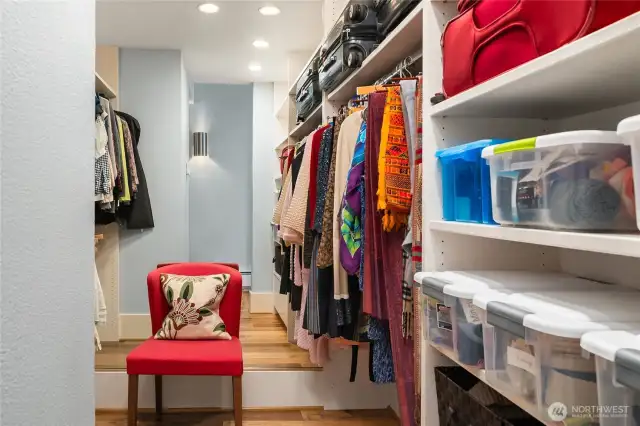 Spacious walk-in closet with built-ins.