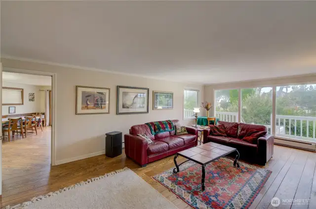 Family room with the kitchen and dining room in the background.