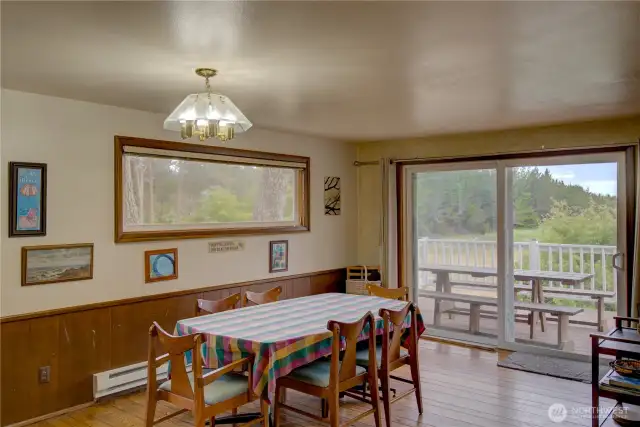 Dining room with ocean view and access to the wraparound deck.