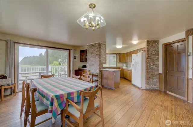 Dining room with ocean view and access to the wrap around deck. the doorway goes int0 the living room.