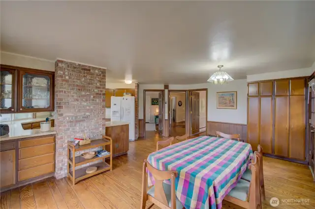 Dining room and kitchen. doorways go to the family room, main entry and formal dining room