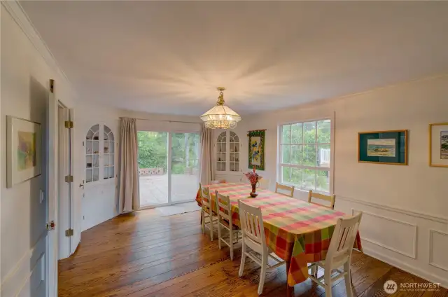 formal dining room with sliding door to the patio and wrap around deck.