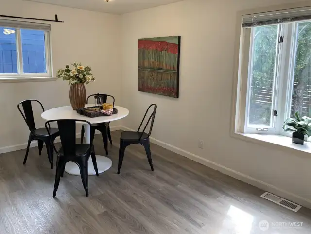 The dining room is large enough for many options. A larger dining table or add a desk of sitting area. Bay windows looks out over the front yard.