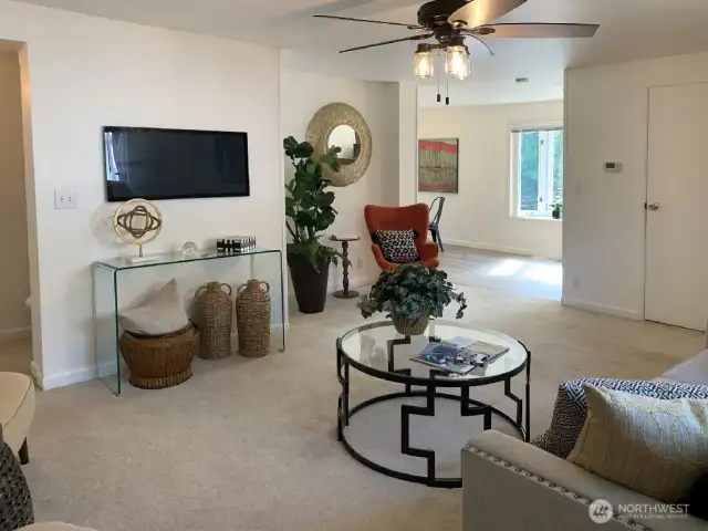The main living room, looking towards the dining room and kitchen.