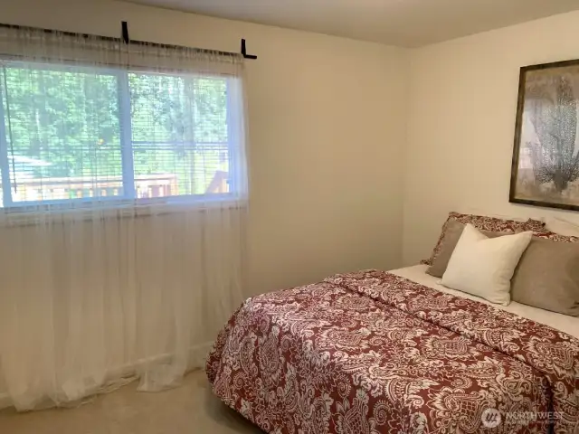 The 2nd bedroom on the main level. As you can see, the window looks out at the back deck and yard.