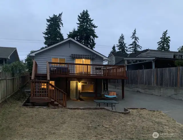 A glimpse at a warm summer evening here... The 4 person hot tub is located on the patio level behind the stairs for the deck.