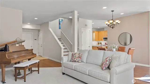 Formal Living Room and Dining Room. Also showing the Garage Door and Entry Door.