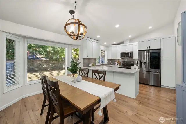 With updated flooring, this dining room that's perfectly situated off the family room and kitchen really 'wows'!