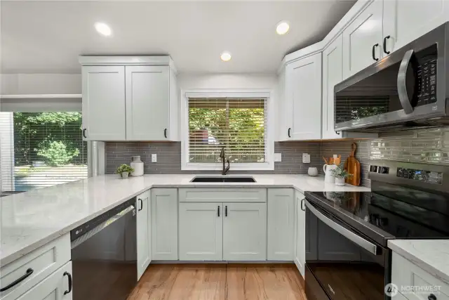 From quartz counters to updated cabinetry - this kitchen is a dream!