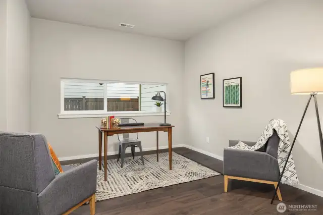 Office or media room on the first floor with same warm hardwood floors.