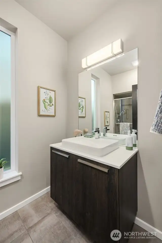 Powder on the main floor, as you can see in the mirror, has a FULL Shower.