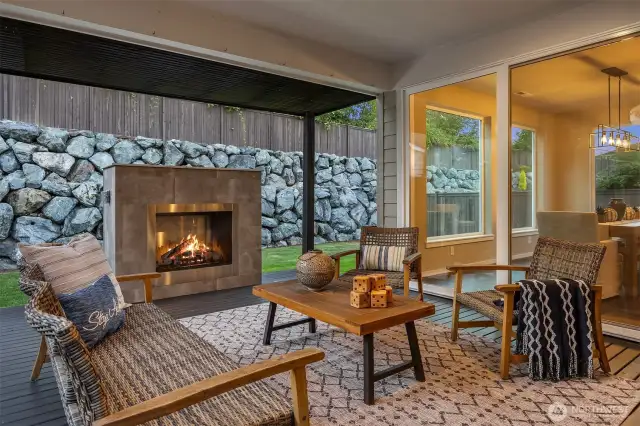 The half tall fireplace is the centerpiece of the large Pergola deck, and is topped with quartz to match the kitchen and bath vanities.