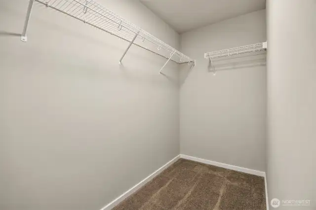 Primary closet with lots of space for design/storage ideas.