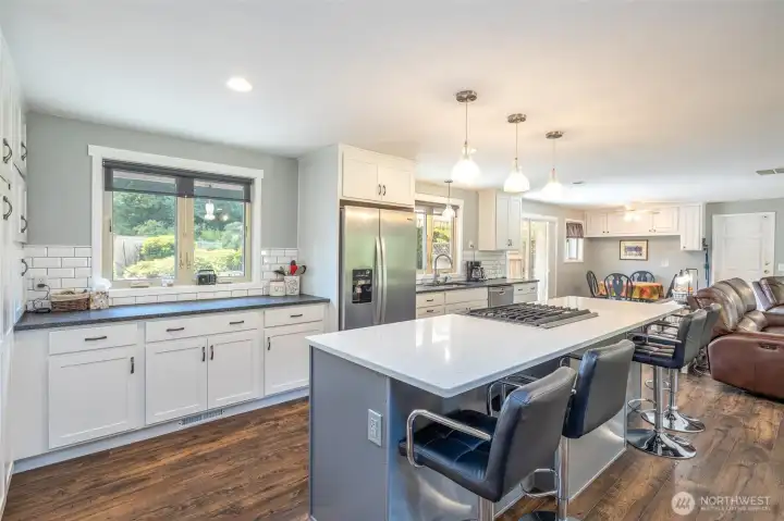 Beautifully remodeled kitchen with quartz countertops and soft close drawers and cabinets.