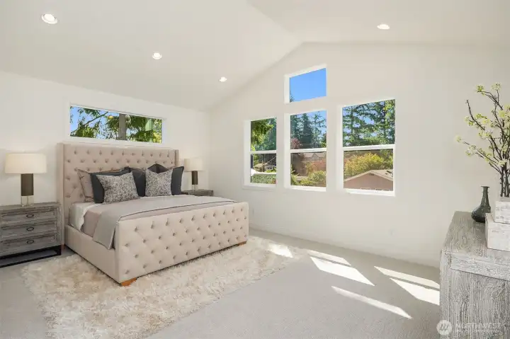 Designer primary suite with five-piece bath with heated floors