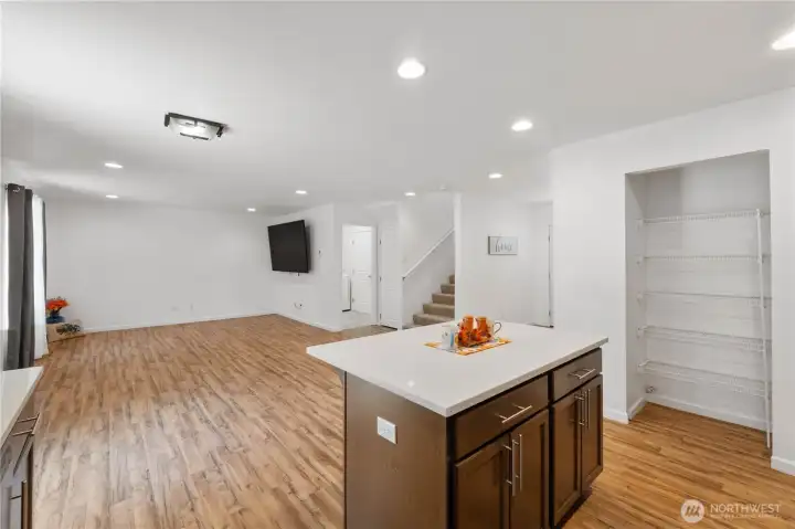 Entertain your guests with the open flow. The large TV stays with the house.