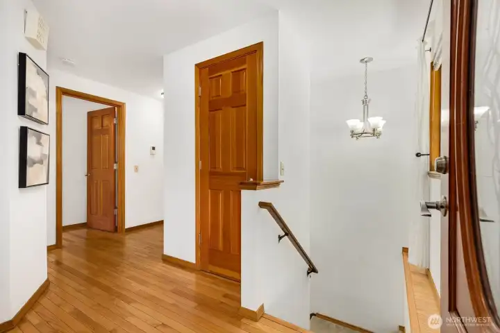 Entry doorway - here you'll find access to the primary bedroom to the left and hallway to the main rooms of the home or head down stairs for your additional 3 bedrooms, family room and easy backyard access