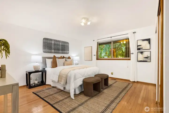 Large primary bedroom located on this main floor, plenty of room in the closets, hardwood floors