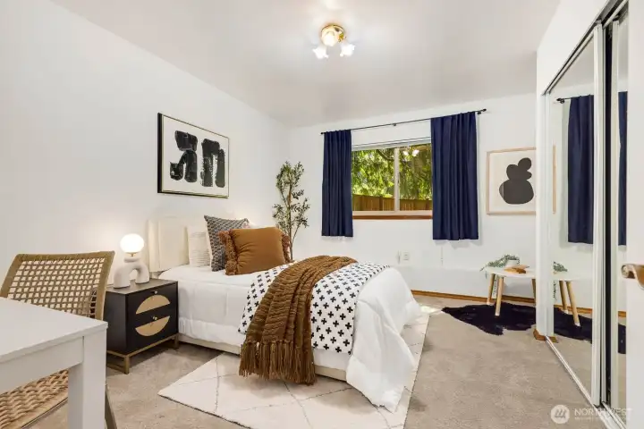Spacious guest bedroom #2, with sitting area and mirrored closets