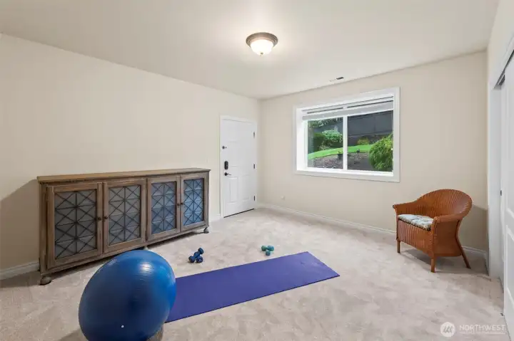 Flexible fitness/yoga room with exterior access.  It's an ideal space for wellness, hobbies, additional storage or a 5th bedroom.