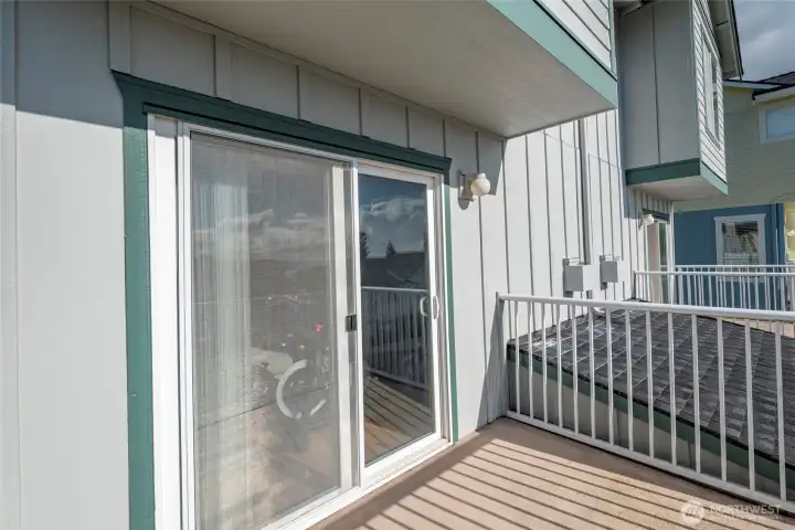Sliding glass door from living room to balcony.
