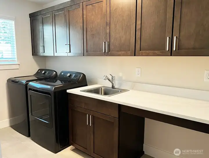 Large laundry room with an abundance of storage. Washer and Dryer included!