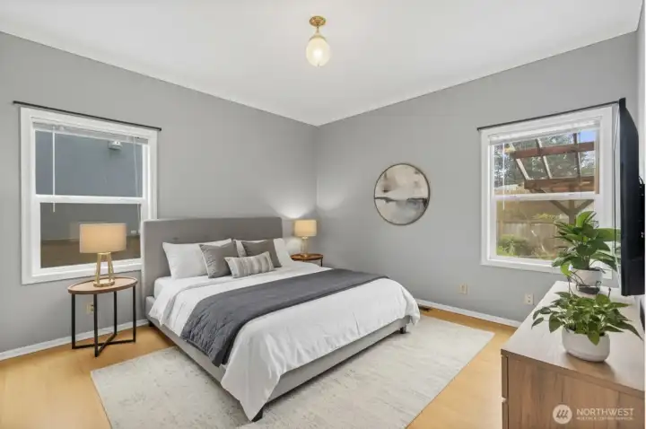 Virtually staged room on main floor showcasing flexible office or bedroom potential