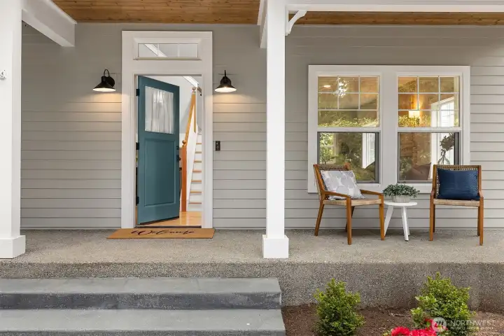 A warm welcome from the very first step in—classic lines, a covered porch, and a front door that sets the tone for everything that follows. Simple, timeless, and quietly inviting, this is where the home begins to feel like yours.