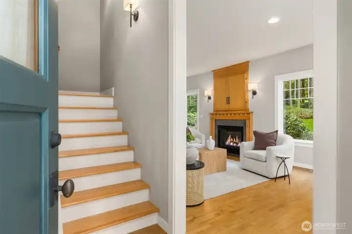 The door opens to light, warmth, and a layout that immediately makes sense. Clean lines, natural wood underfoot, and sightlines that carry you effortlessly into the heart of the home.