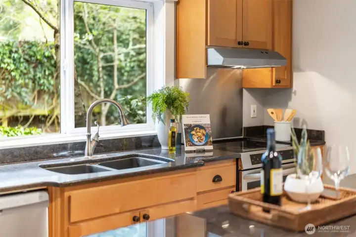 At the window, a quieter vignette—morning light, garden views, and a sense of calm that elevates even the simplest rituals.