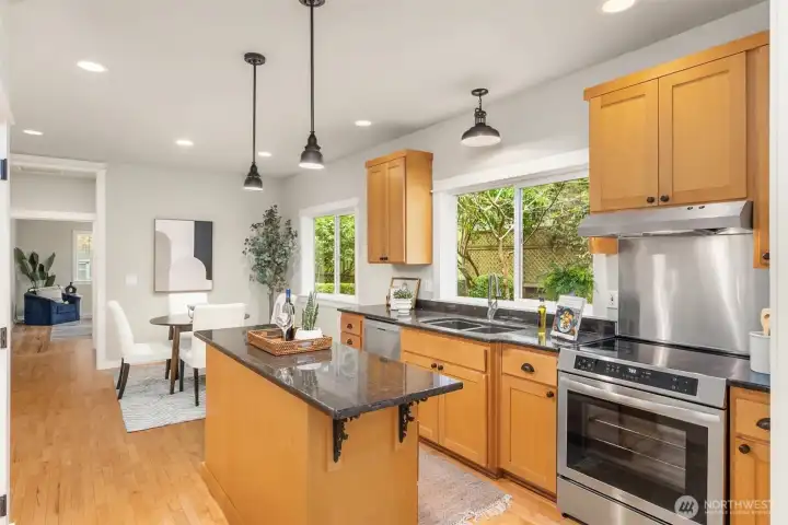 Expansive and open, the kitchen reveals its full scale—anchored by new appliances and a layout designed for effortless flow between cooking, gathering, and entertaining.