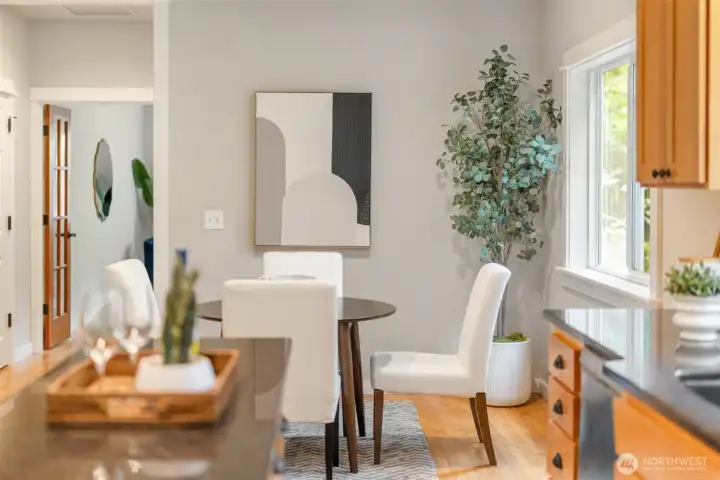 Tucked just off the kitchen, a quiet dining nook—perfectly scaled for morning coffee, casual meals, and intimate conversation.