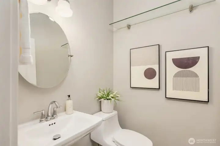 Even the powder room reflects the home’s thoughtful design—clean lines, soft tones, and curated details creating a refined, understated moment.
