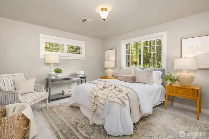 Upstairs, the primary suite feels like a retreat—private, peaceful, and intentionally removed from the pace of the day.