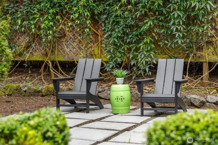 A tucked-away corner of the garden—intimate, quiet, and framed by lush greenery, offering a peaceful place to unwind.