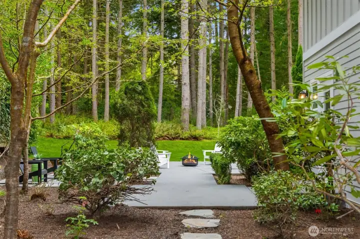 Winding paths connect each part of the property, creating a sense of movement and discovery across the grounds.