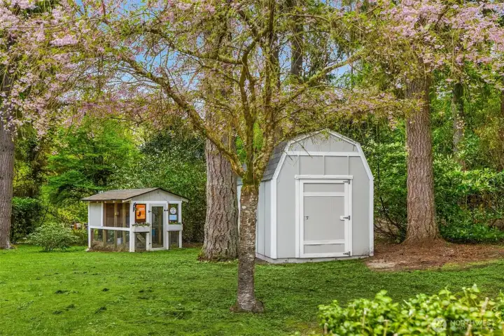 A charming and functional addition to the grounds—detached shed and chicken coop offering flexibility for storage, hobbies, or a touch of homestead living.